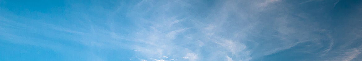 blue sky with white wispy clouds