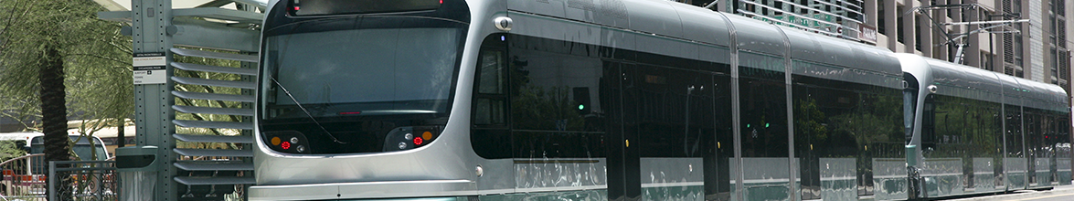 light rail at a stop in the city